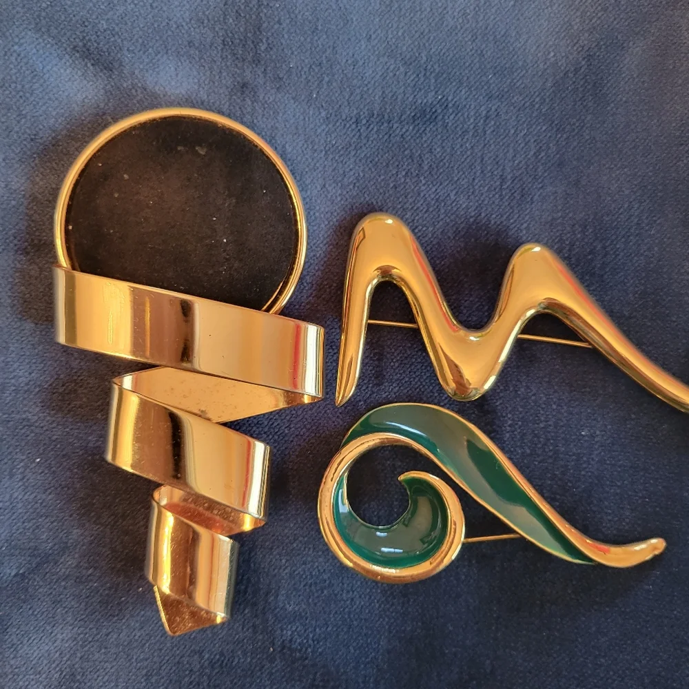Trifari trio brooches